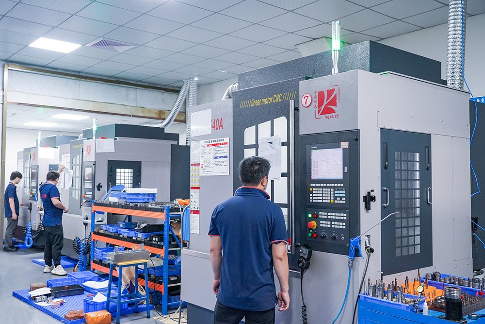 CNC machining centres and operators in the Cents Mould machine shop, Humen, Dongguan